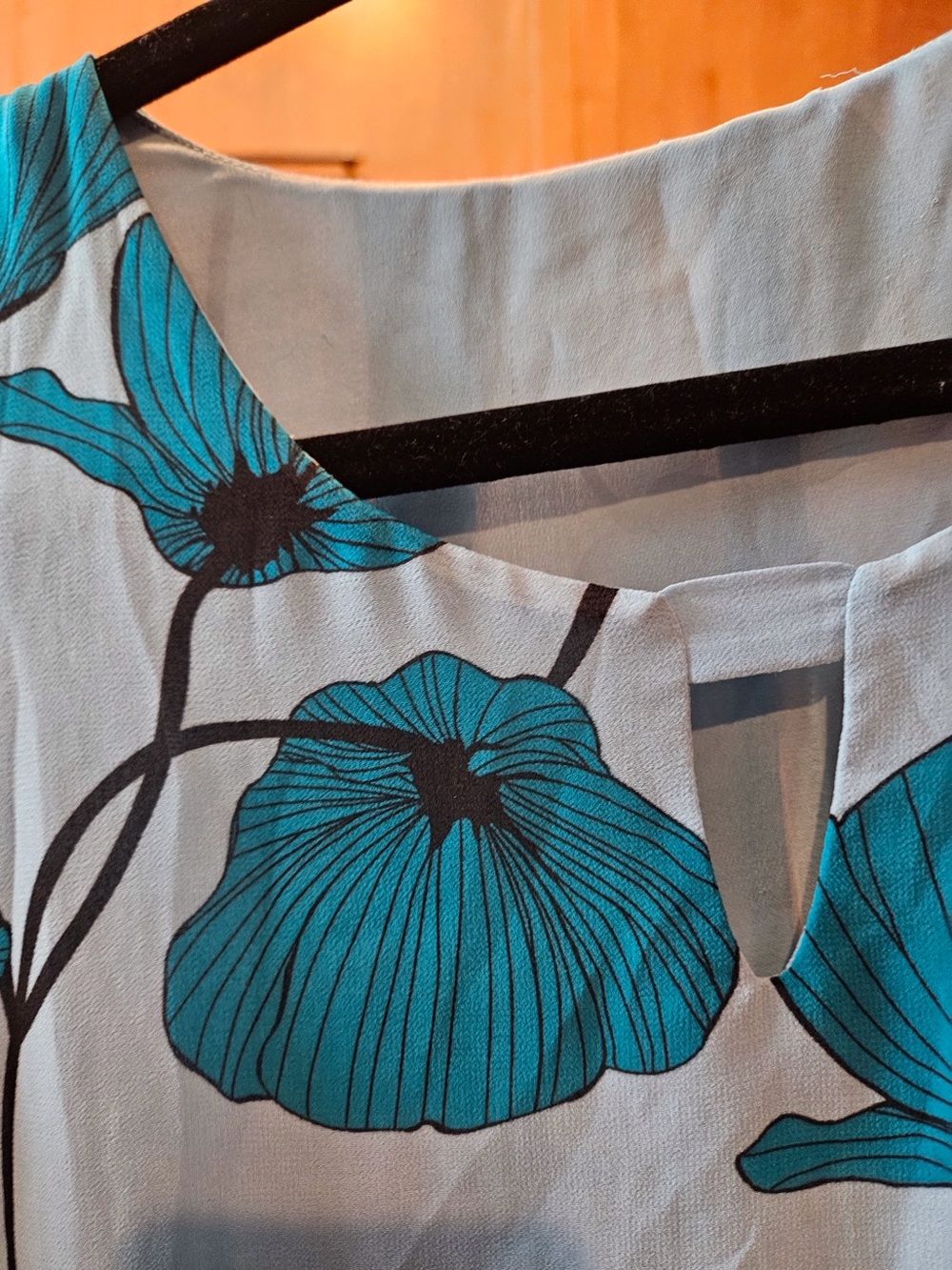 White background Floral Print Blouse with Teal Accent